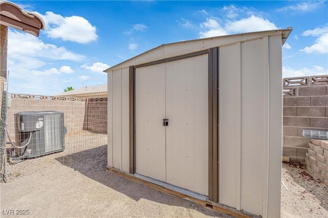 3905 Blairmoor St, North Las Vegas, NV 89032 - view of shed with central air condition unit and a fenced backyard