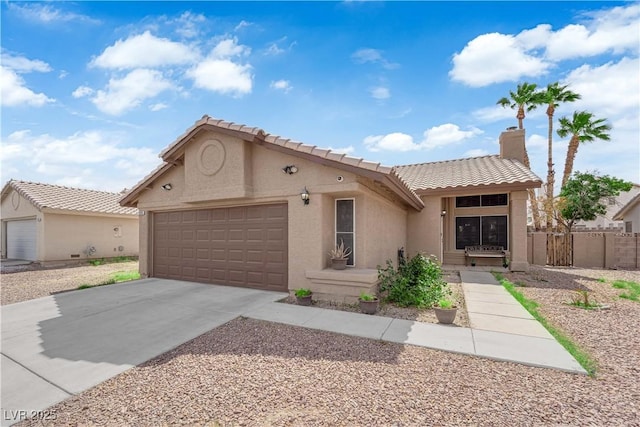 3905 Blairmoor St, North Las Vegas, NV 89032 - view of front of house with a tiled roof, stucco siding, a garage, and concrete driveway