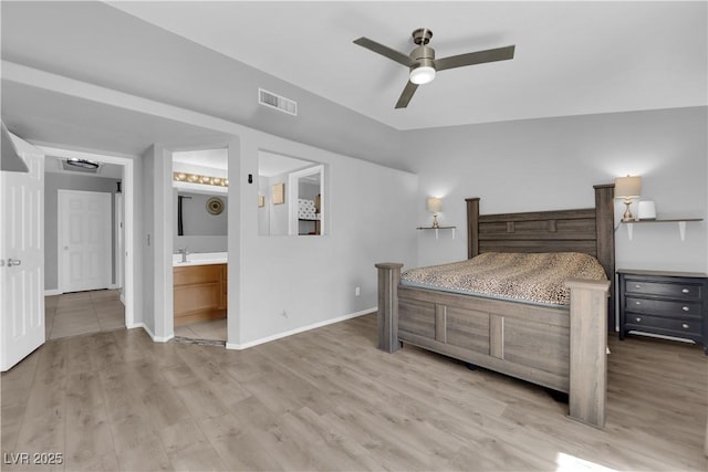 3905 Blairmoor St, North Las Vegas, NV 89032 - bedroom featuring light wood-type flooring, baseboards, connected bathroom, and a ceiling fan