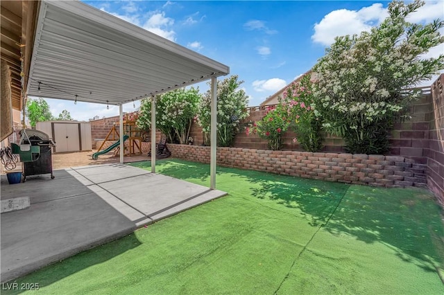 3905 Blairmoor St, North Las Vegas, NV 89032 - fenced backyard with a patio area and a playground