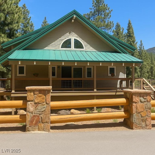 4178 Matterhorn Way, Las Vegas, NV 89124 - view of front of home with a standing seam roof, covered porch, and metal roof