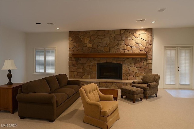 4178 Matterhorn Way, Las Vegas, NV 89124 - living room featuring light carpet, recessed lighting, and a stone fireplace