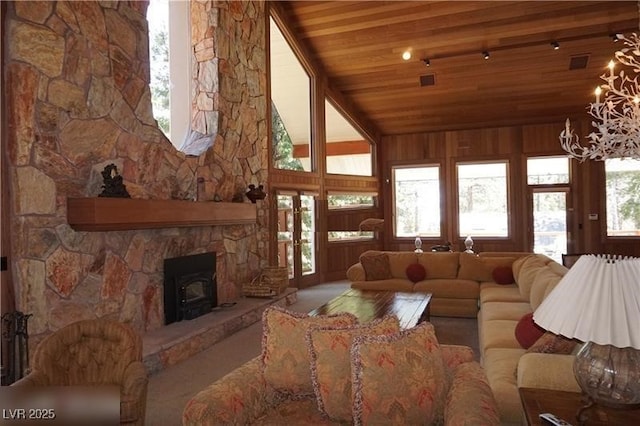 4178 Matterhorn Way, Las Vegas, NV 89124 - living room featuring wood ceiling, a wood stove, and lofted ceiling