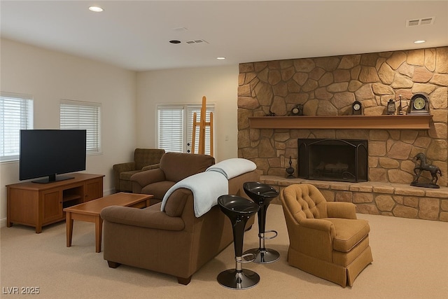 4178 Matterhorn Way, Las Vegas, NV 89124 - living area with light carpet, a stone fireplace, and recessed lighting