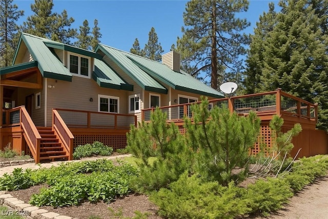 4178 Matterhorn Way, Las Vegas, NV 89124 - rear view of house featuring a chimney, a standing seam roof, a deck, and metal roof