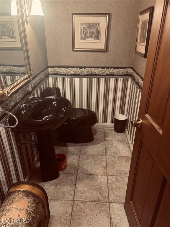 4178 Matterhorn Way, Las Vegas, NV 89124 - half bathroom with toilet and wallpapered walls