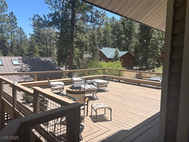 4178 Matterhorn Way, Las Vegas, NV 89124 - deck featuring view of wooded area and an outdoor structure