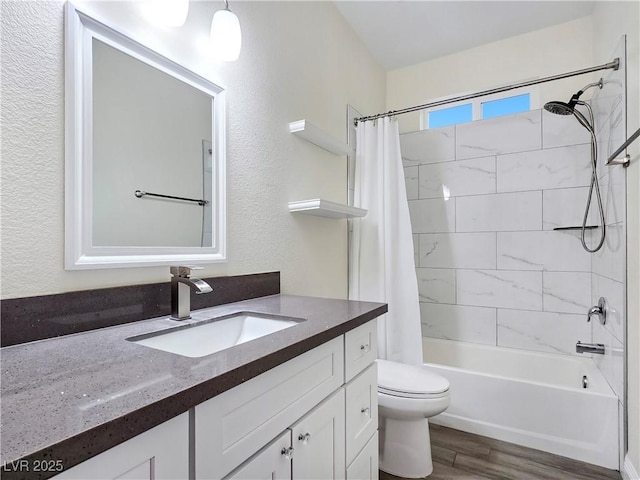 5500 Santovito St, Pahrump, NV 89061 - full bath with vanity, shower / bath combo with shower curtain, wood finished floors, toilet, and a textured wall