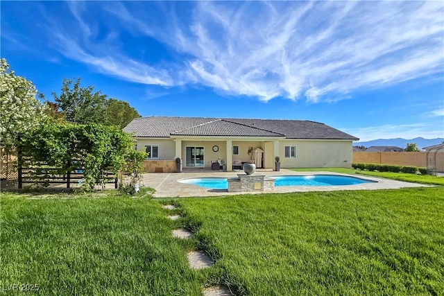 5500 Santovito St, Pahrump, NV 89061 - rear view of house featuring a patio, a tiled roof, and stucco siding