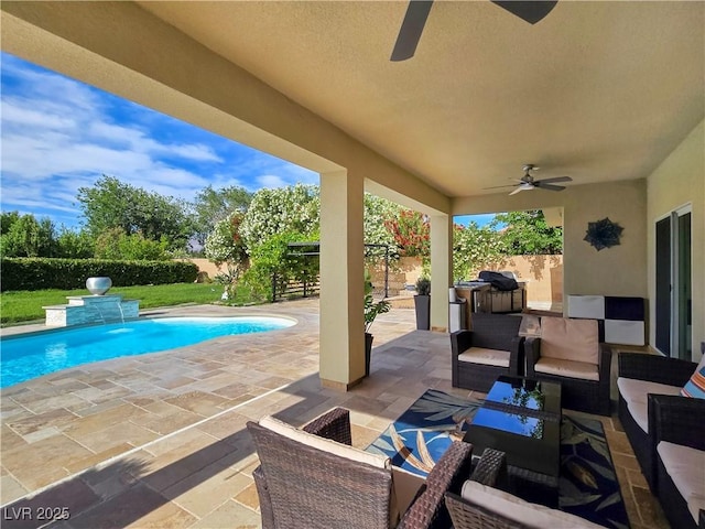 5500 Santovito St, Pahrump, NV 89061 - fenced backyard with a ceiling fan, a patio area, and outdoor lounge area