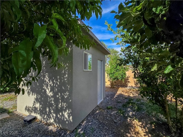 5500 Santovito St, Pahrump, NV 89061 - view of side of home with stucco siding