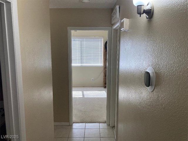 5821 Santa Catalina Ave, Las Vegas, NV 89108 - hall featuring light tile patterned floors and light carpet