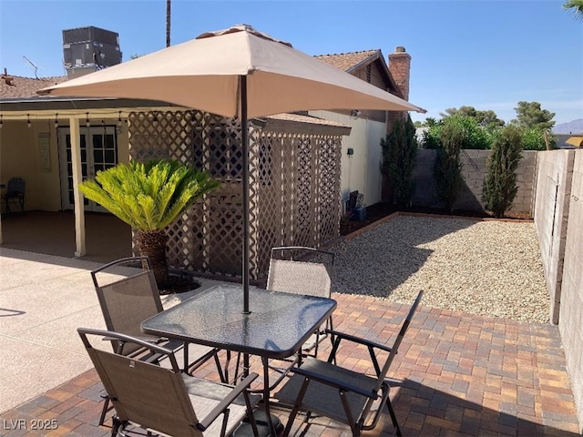 5821 Santa Catalina Ave, Las Vegas, NV 89108 - fenced backyard with outdoor dining area and a patio