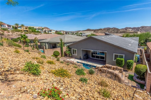 8 Via Tiberina, Las Vegas, NV 89011 - back of house with stucco siding, a residential view, and a mountain view