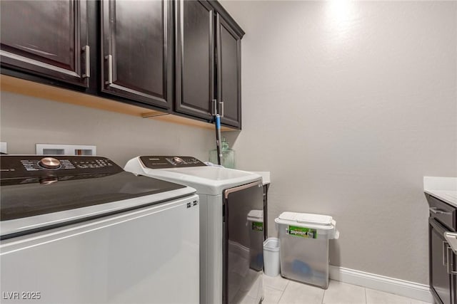 8 Via Tiberina, Las Vegas, NV 89011 - washroom with washing machine and dryer, cabinet space, baseboards, and light tile patterned floors