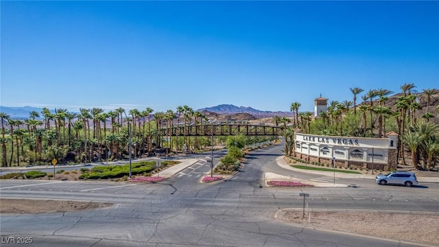 8 Via Tiberina, Las Vegas, NV 89011 - view of asphalt road featuring a mountain view, sidewalks, and curbs