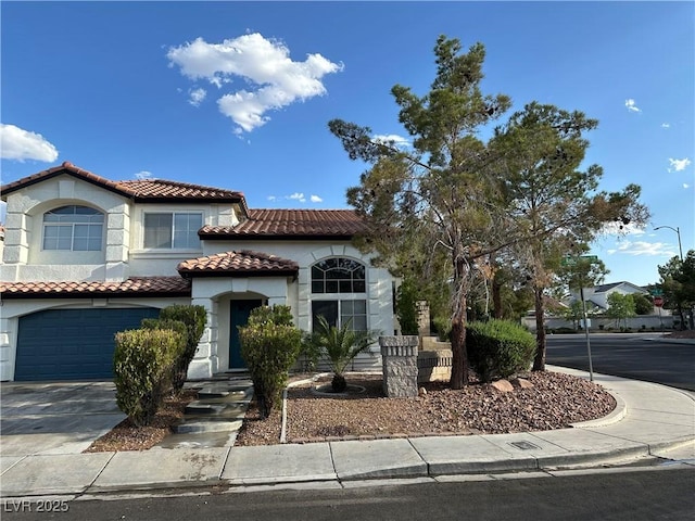 1511 Balsam Mist Ave, Las Vegas, NV 89183 - mediterranean / spanish-style house featuring a tiled roof, driveway, stucco siding, and a garage