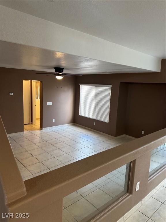1511 Balsam Mist Ave, Las Vegas, NV 89183 - spare room featuring light tile patterned floors and ceiling fan