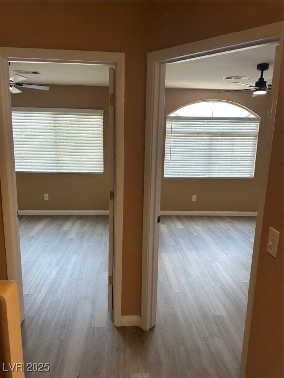 1511 Balsam Mist Ave, Las Vegas, NV 89183 - hallway featuring wood finished floors, baseboards, and plenty of natural light