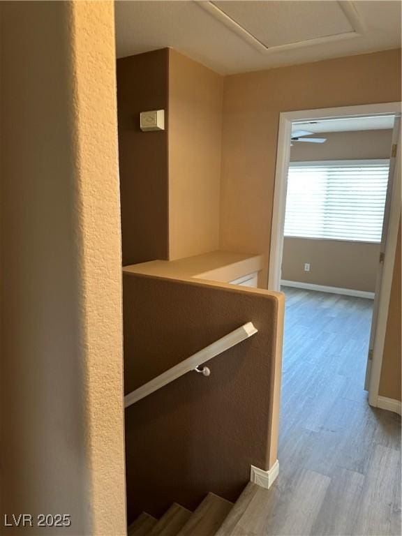 1511 Balsam Mist Ave, Las Vegas, NV 89183 - corridor featuring an upstairs landing, wood finished floors, baseboards, and attic access