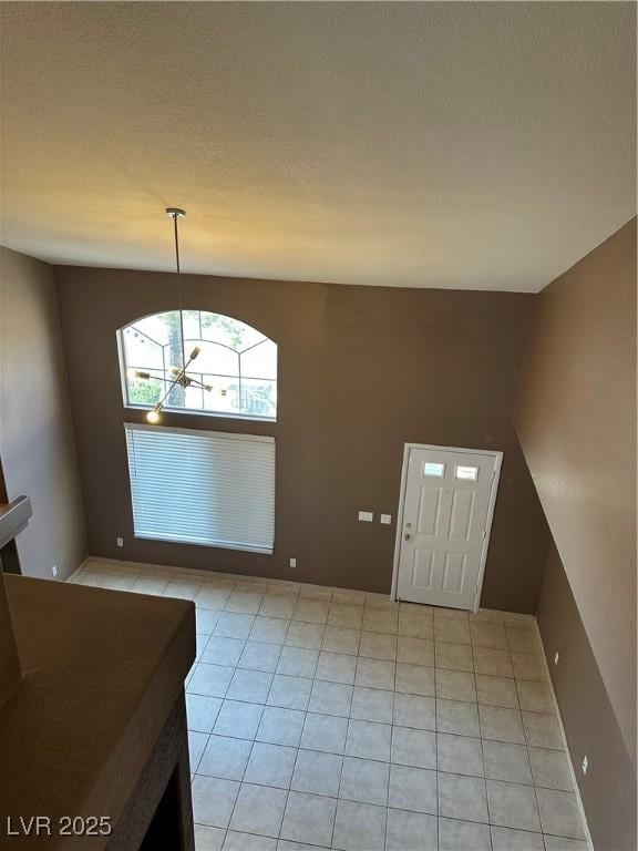 1511 Balsam Mist Ave, Las Vegas, NV 89183 - entryway featuring light tile patterned floors and a chandelier