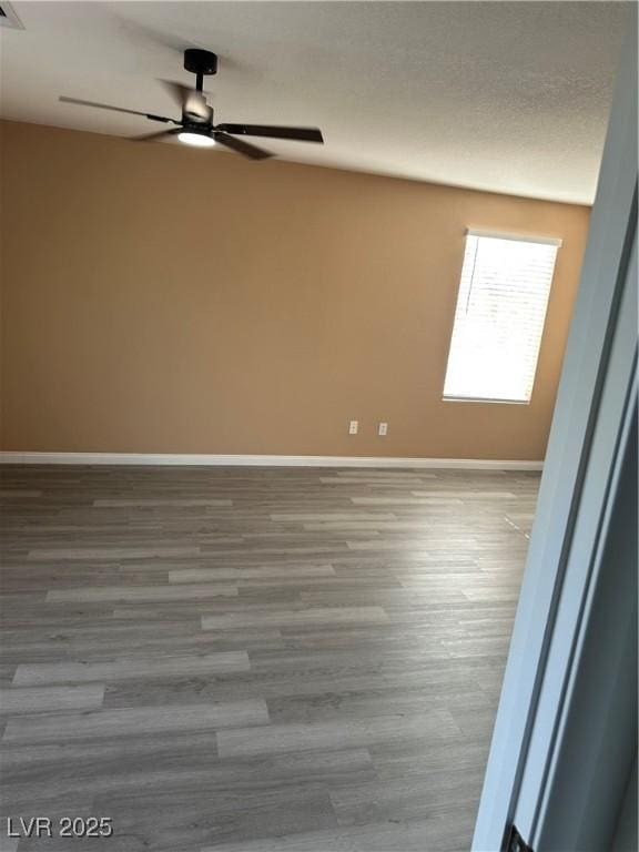 1511 Balsam Mist Ave, Las Vegas, NV 89183 - empty room featuring ceiling fan, wood finished floors, and baseboards