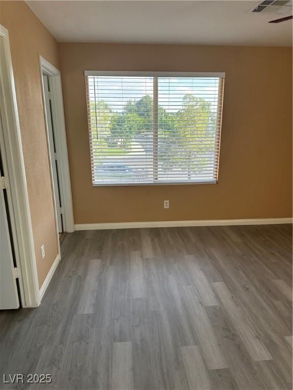 1511 Balsam Mist Ave, Las Vegas, NV 89183 - spare room featuring wood finished floors and baseboards