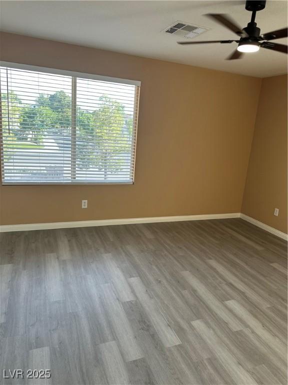 1511 Balsam Mist Ave, Las Vegas, NV 89183 - empty room featuring ceiling fan, wood finished floors, and baseboards
