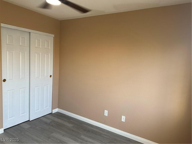 1511 Balsam Mist Ave, Las Vegas, NV 89183 - unfurnished bedroom featuring dark wood-type flooring, baseboards, a closet, and ceiling fan