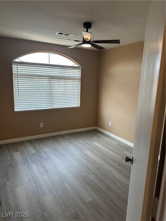 1511 Balsam Mist Ave, Las Vegas, NV 89183 - unfurnished room featuring wood finished floors, ceiling fan, and baseboards