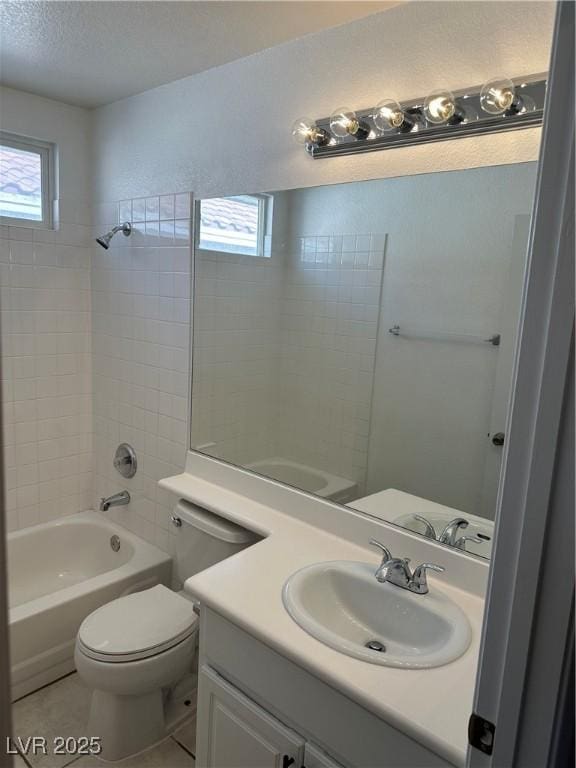 1511 Balsam Mist Ave, Las Vegas, NV 89183 - full bathroom with toilet, vanity, washtub / shower combination, tile patterned flooring, and a textured ceiling