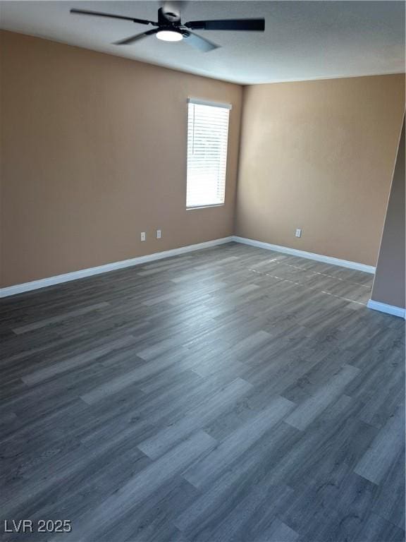 1511 Balsam Mist Ave, Las Vegas, NV 89183 - unfurnished room with ceiling fan, baseboards, and dark wood finished floors
