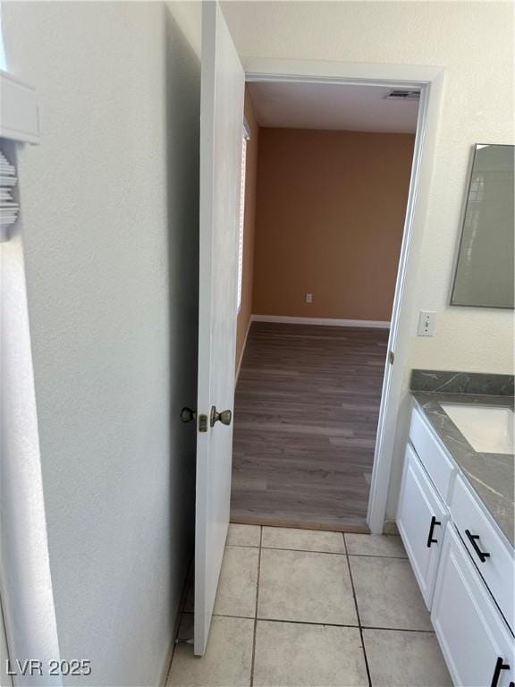 1511 Balsam Mist Ave, Las Vegas, NV 89183 - corridor with a sink, light tile patterned floors, and baseboards