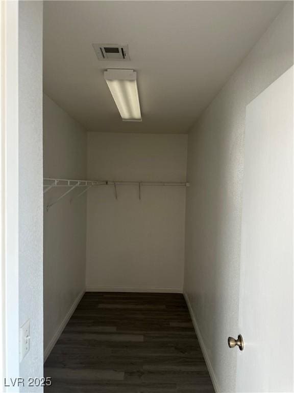 1511 Balsam Mist Ave, Las Vegas, NV 89183 - walk in closet with dark wood-type flooring