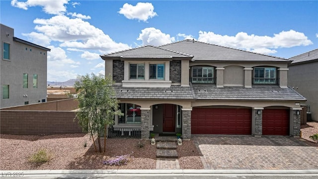 7255 Bold Rock Ave, Las Vegas, NV 89113 - view of front of home featuring stone siding, a garage, and decorative driveway