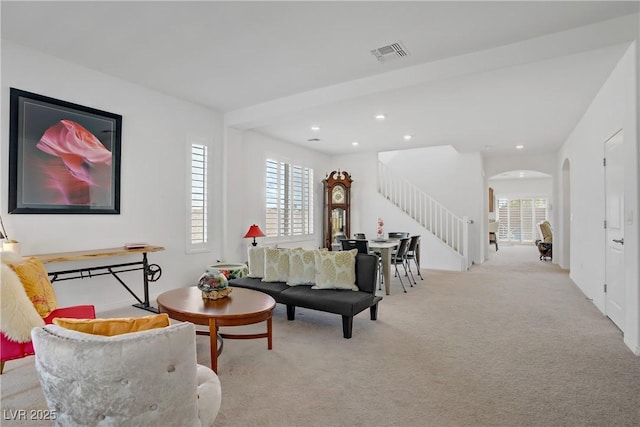 7255 Bold Rock Ave, Las Vegas, NV 89113 - living room with stairs, plenty of natural light, carpet flooring, and recessed lighting