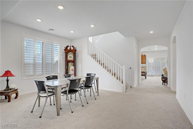 7255 Bold Rock Ave, Las Vegas, NV 89113 - dining area with carpet, arched walkways, plenty of natural light, stairway, and recessed lighting