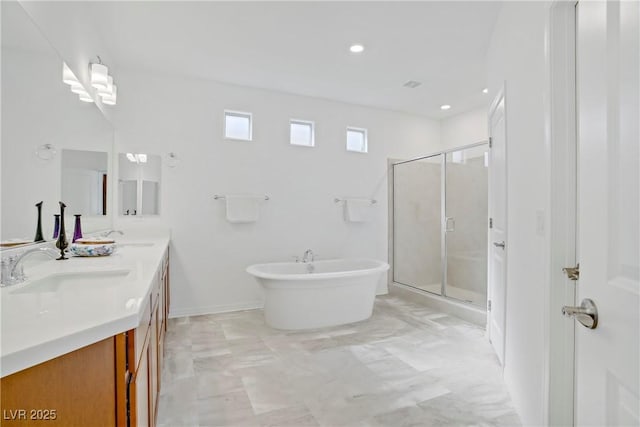 7255 Bold Rock Ave, Las Vegas, NV 89113 - bathroom featuring double vanity, a freestanding bath, a shower stall, marble finish floors, and recessed lighting