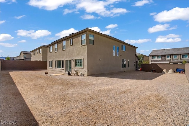 7255 Bold Rock Ave, Las Vegas, NV 89113 - rear view of property with a fenced backyard and stucco siding