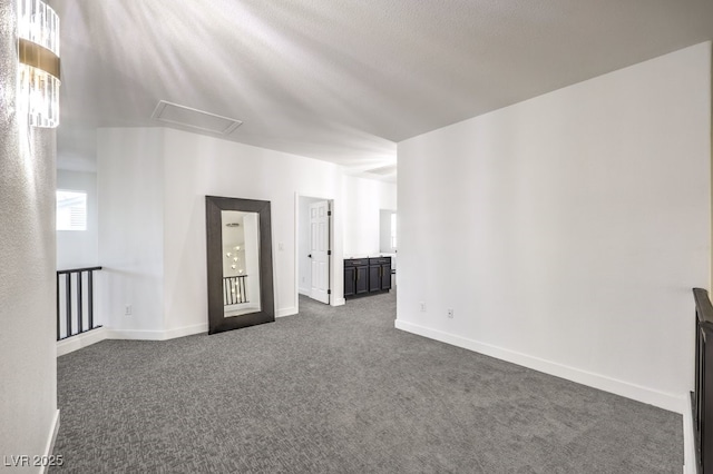722 Descartes Ave, Henderson, NV 89002 - unfurnished room featuring dark colored carpet, attic access, and baseboards