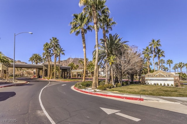 722 Descartes Ave, Henderson, NV 89002 - view of asphalt road with street lighting, curbs, sidewalks, and a mountain view