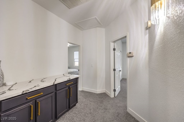 722 Descartes Ave, Henderson, NV 89002 - hallway with dark carpet, attic access, and baseboards