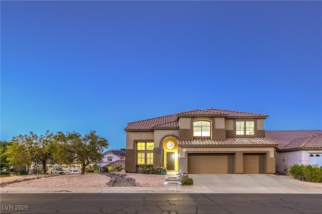 722 Descartes Ave, Henderson, NV 89002 - mediterranean / spanish-style home featuring a garage, stucco siding, driveway, and a tile roof
