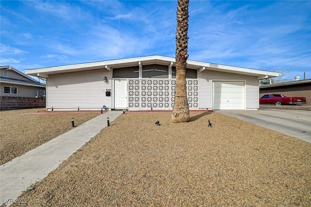 2496 Golfers St, Las Vegas, NV 89142 - mid-century inspired home featuring an attached garage and driveway