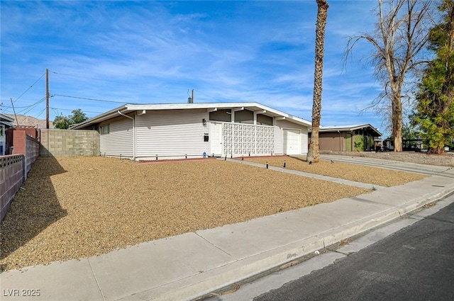 2496 Golfers St, Las Vegas, NV 89142 - view of front of home with a garage and driveway