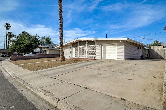 2496 Golfers St, Las Vegas, NV 89142 - view of front of house featuring a garage and driveway