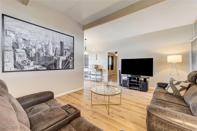 2496 Golfers St, Las Vegas, NV 89142 - living room with lofted ceiling, wood finished floors, and baseboards