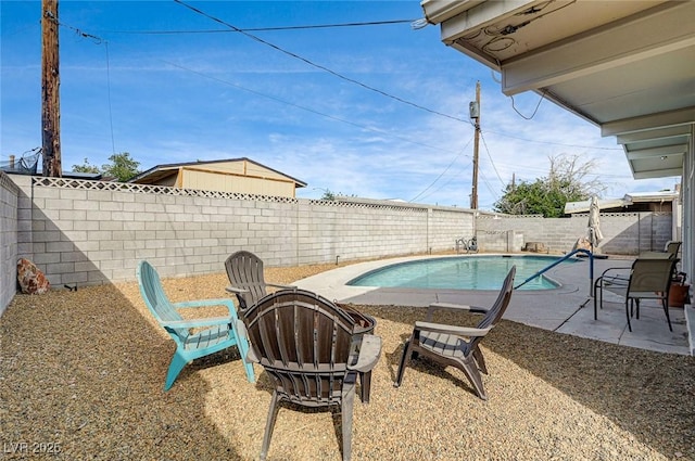 2496 Golfers St, Las Vegas, NV 89142 - view of swimming pool featuring a patio, a fenced backyard, and a fire pit
