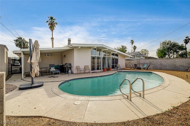 2496 Golfers St, Las Vegas, NV 89142 - view of pool featuring a patio, a fenced backyard, and area for grilling