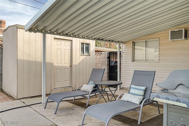 2496 Golfers St, Las Vegas, NV 89142 - view of patio with a gate and an AC wall unit